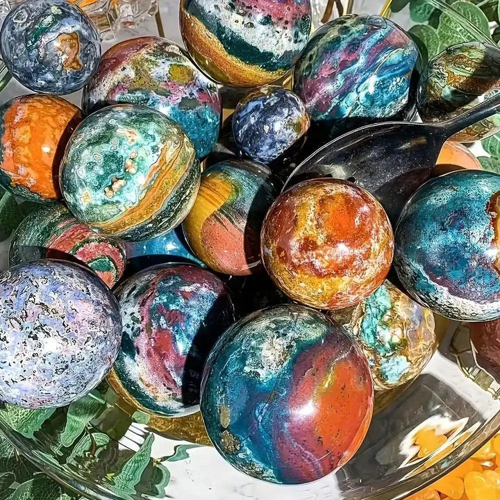 Large Ocean Jasper spheres featuring swirling green, pink, and blue orbs to radiate calm, joy, and emotional healing energy.