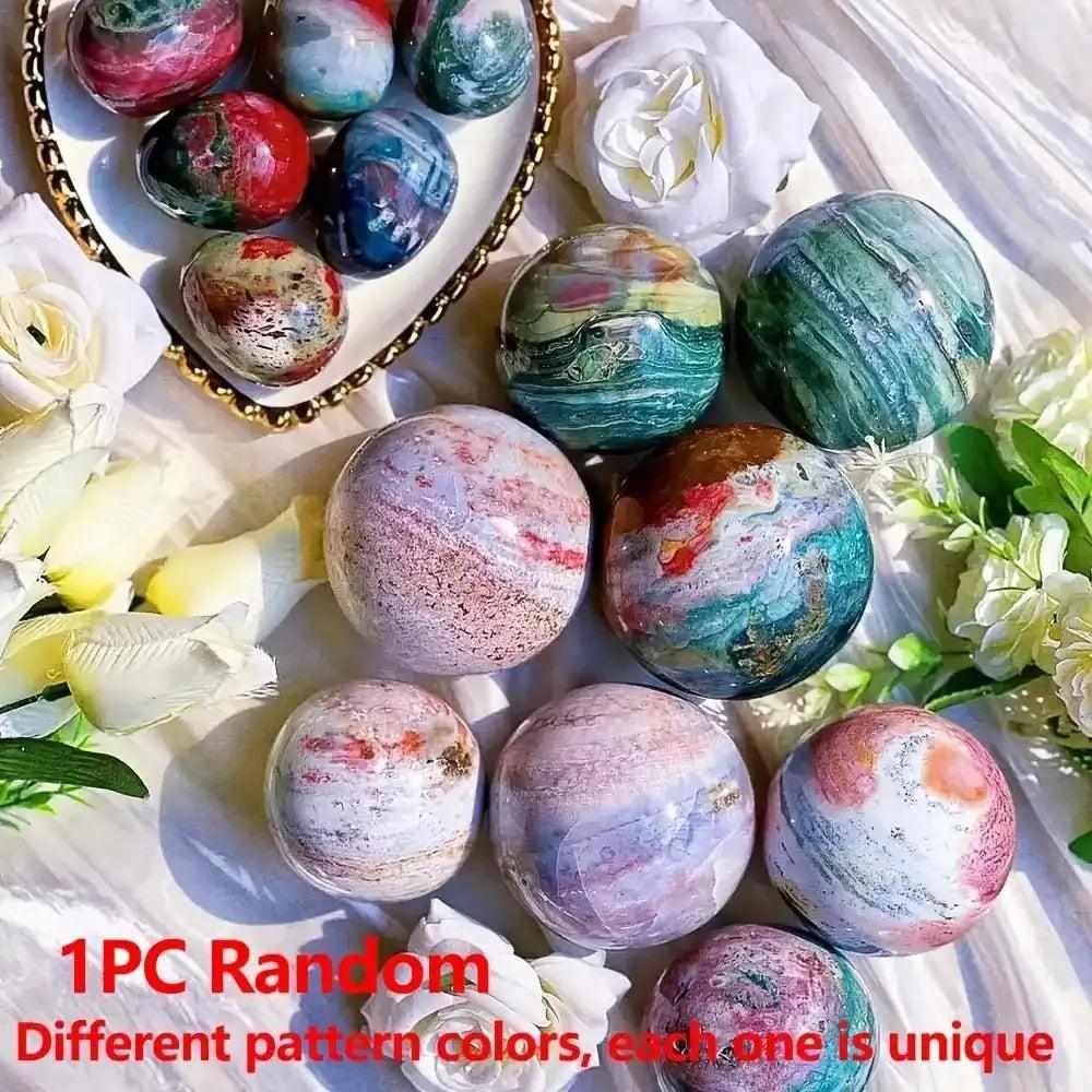 Hand-polished Large Ocean Jasper spheres featuring swirling green, pink, and cream orbs for calming heart chakra energy.