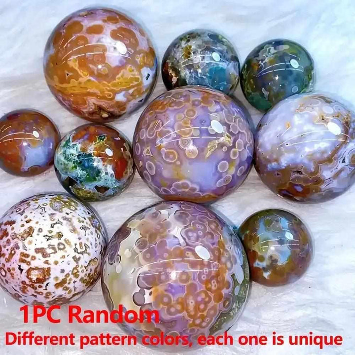 Hand-polished Ocean Jasper spheres featuring unique green, pink, and cream orbicular patterns for calm and joy.