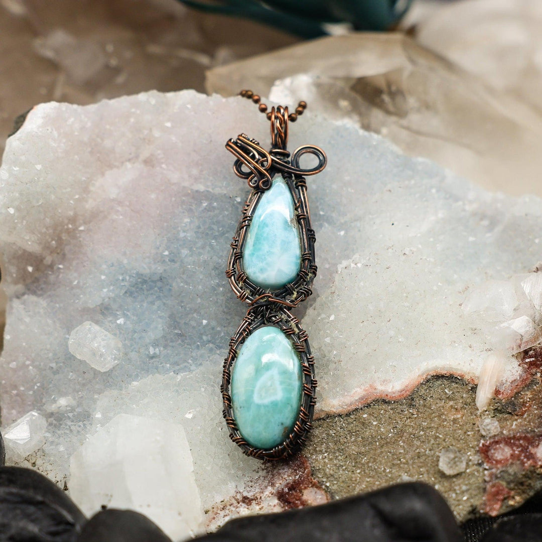Dual Larimar Wire Wrap Pendant: 3.5" handcrafted copper pendant with two calming, ocean-blue Larimar crystals.