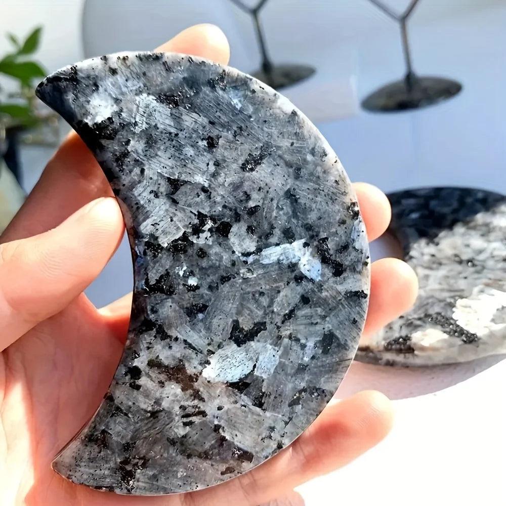 Polished Larvikite moon carving with dark grey tones and a striking silver-blue flash for grounding energy.