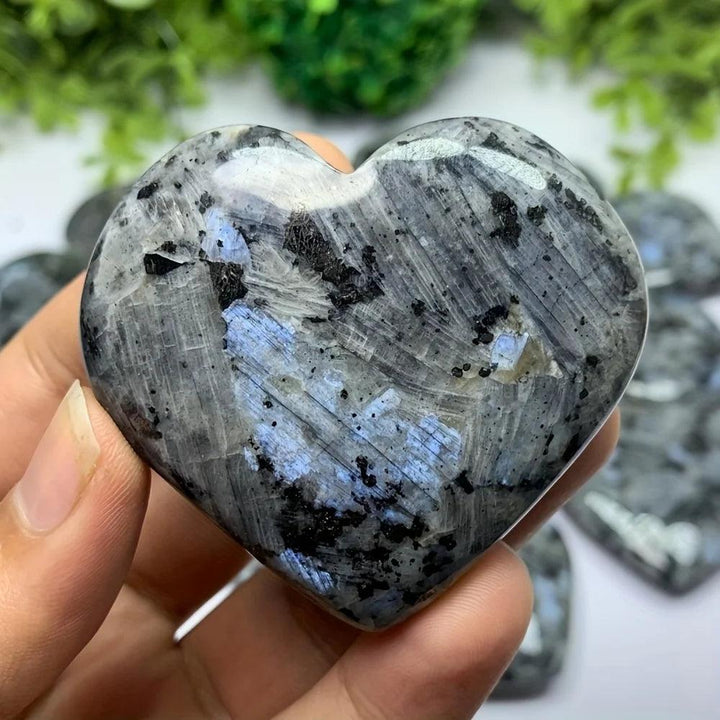 Polished Larvikite heart crystal with dark grey stone and a striking silver-blue flash for grounding energy.