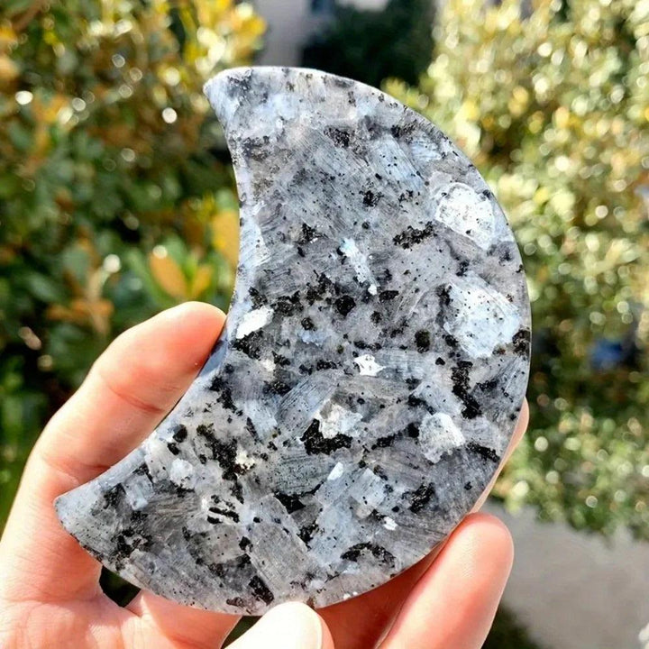Polished Larvikite moon crystal with dark grey tones and a shimmering silver-blue flash for grounding energy.