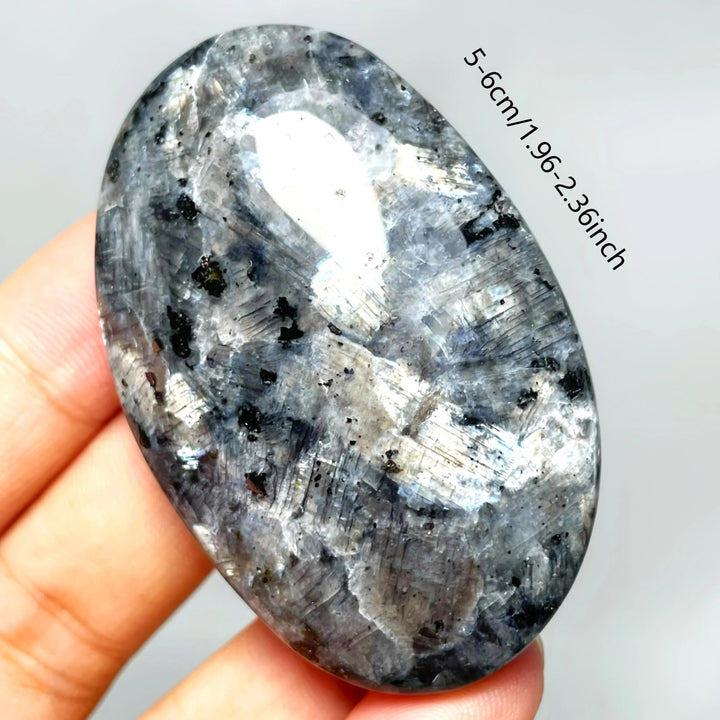 Polished Larvikite crystal palm stone with a striking silver-blue flash, perfect for grounding and meditation.
