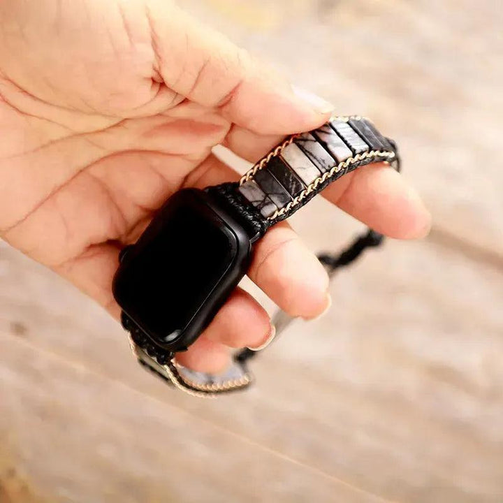 Handcrafted black lava stone and grey jasper Apple iWatch band by Crystal Destiny, offering grounding energy and style.