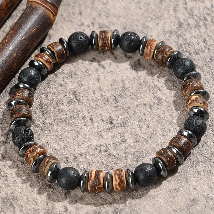 Men's Lava Stone, Wood, and Hematite Beaded Bracelet. Grounding volcanic lava, warm wood, and cool hematite beads.