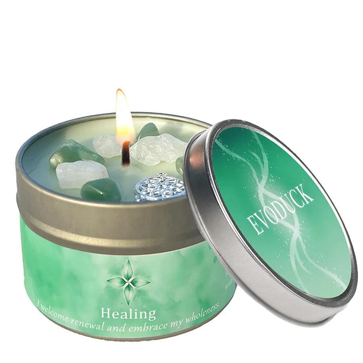 Healing Lemon Peppermint intention candle with green aventurine and clear quartz crystals in a tin.