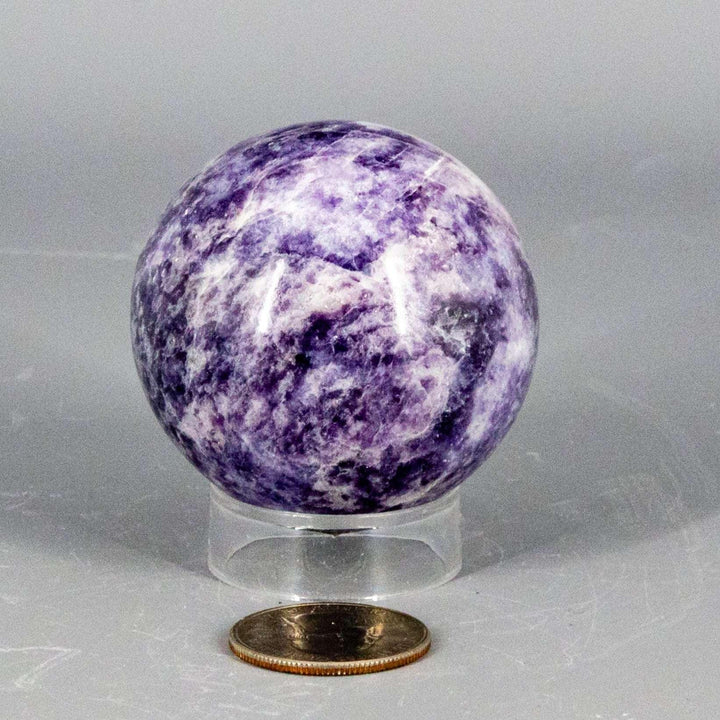 Lepidolite Sphere 55mm: Polished lavender to soft purple sphere, showcasing its calming, mood-stabilizing properties.