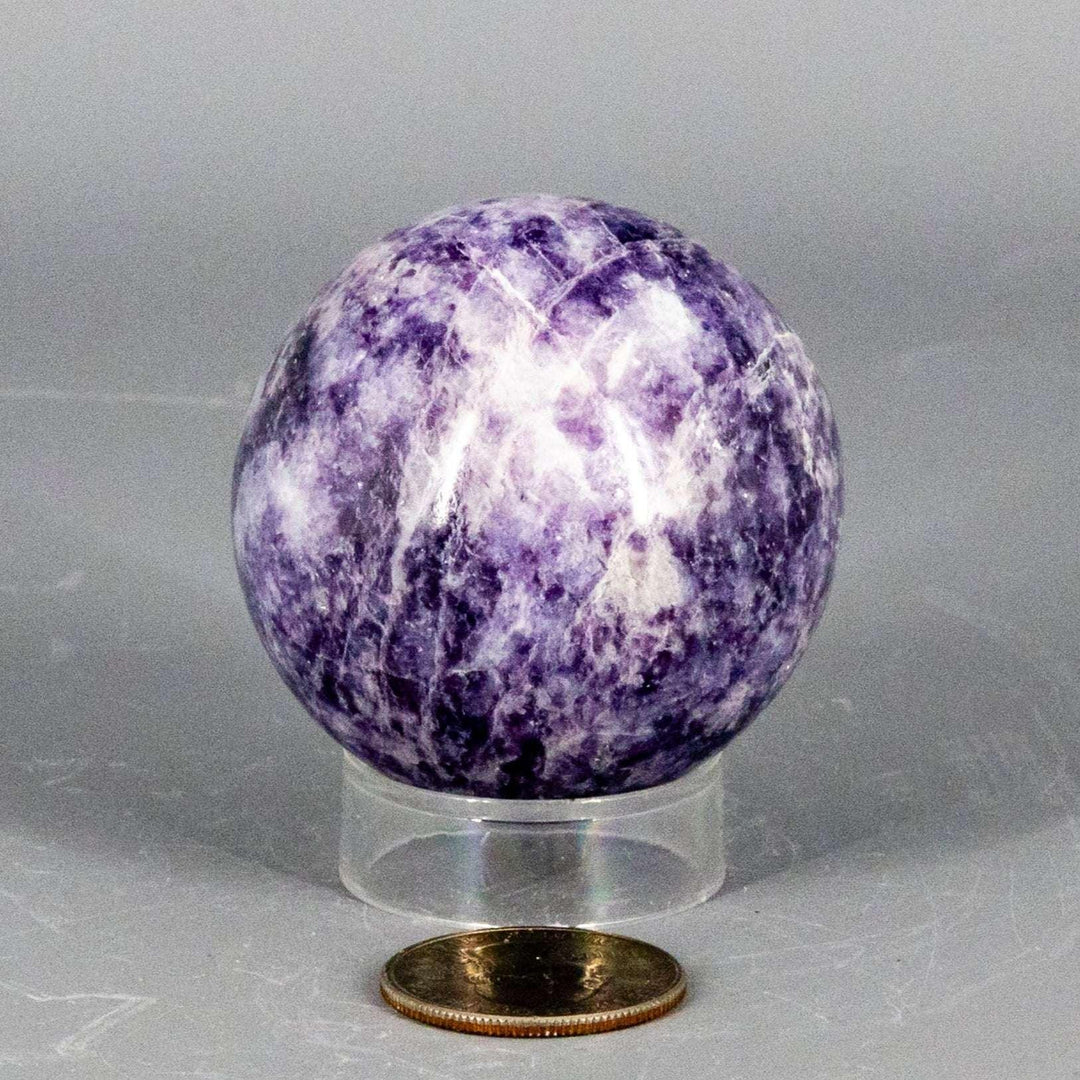 Lepidolite Sphere 55mm: Polished lavender to soft purple sphere with subtle shimmer, promoting calm and balance.