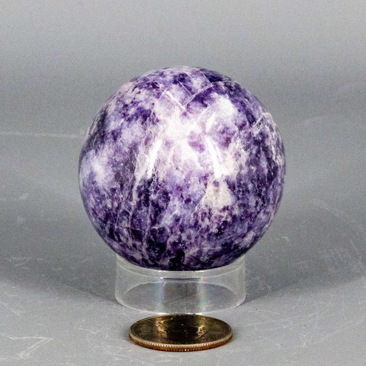 Lepidolite Sphere 55mm: Polished lavender to soft purple sphere with subtle shimmer, promoting calm and balance.