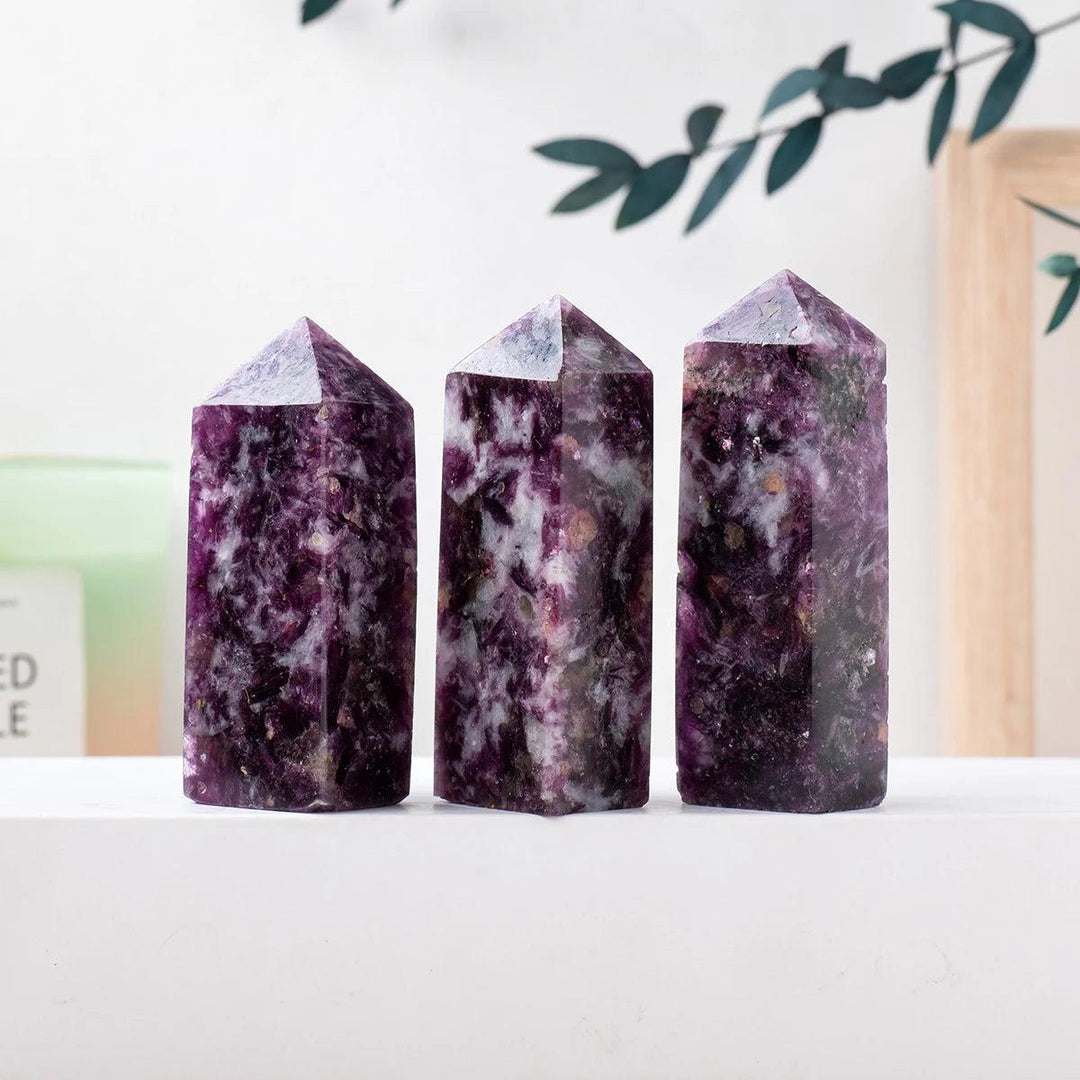 Three natural lepidolite crystal towers with deep purple hues, perfect for healing, meditation, and home decor displays.