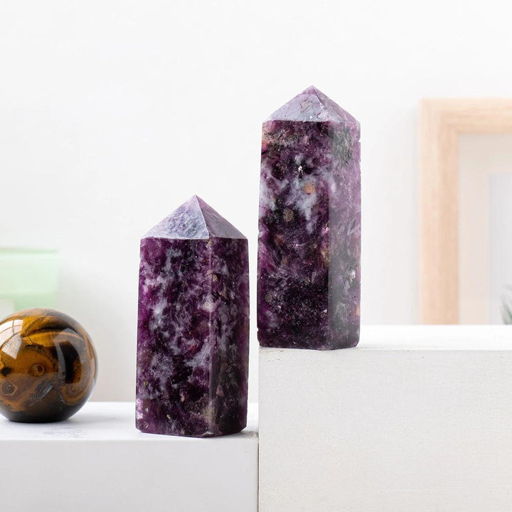 Natural Lepidolite crystal tower wands with deep purple hues, perfect for healing, meditation, and home decor displays.