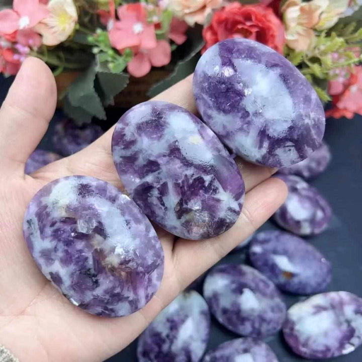 Smooth lavender Lepidolite palm stone with silvery mica flecks, perfect for calming meditation and emotional balance.