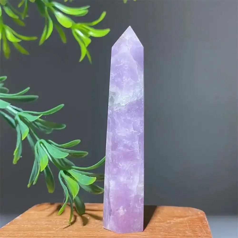 Polished lilac Lepidolite tower point with a sparkling finish, perfect for calming energy and chakra alignment.