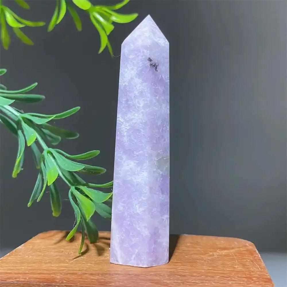 Polished lilac Lepidolite tower point with a sparkling finish, perfect for calming energy and chakra alignment.