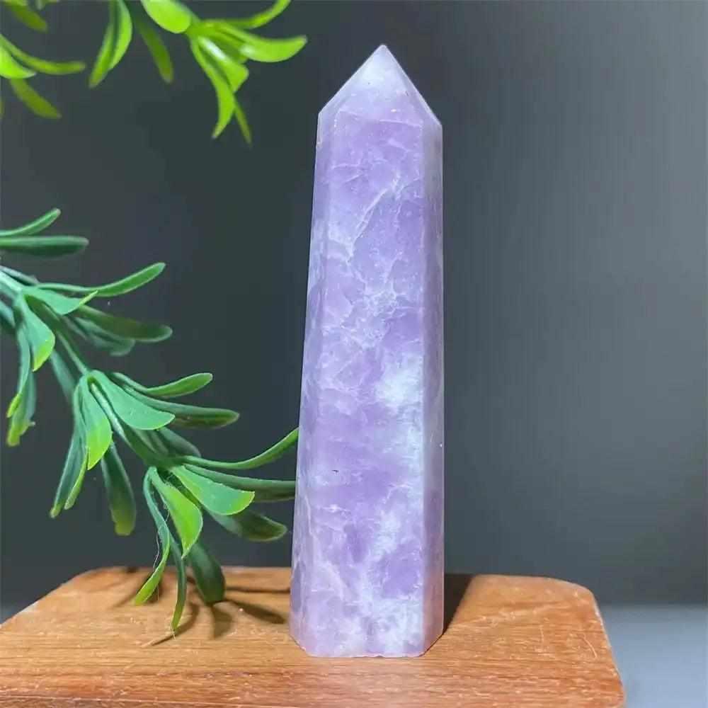 Polished lilac Lepidolite tower point with a sparkling finish, perfect for calming energy and chakra alignment.