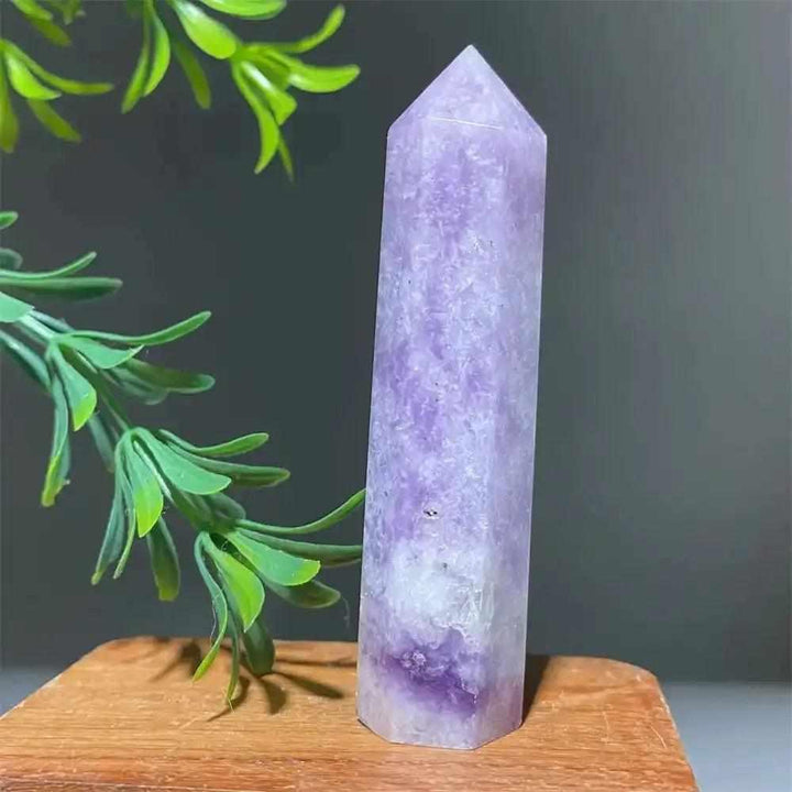 Polished lilac Lepidolite tower point with sparkling shimmer, perfect for calming energy and chakra balancing.