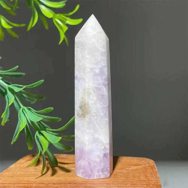 Polished Lepidolite tower point in soft lilac with a sparkling shimmer, perfect for calming energy and chakra healing.