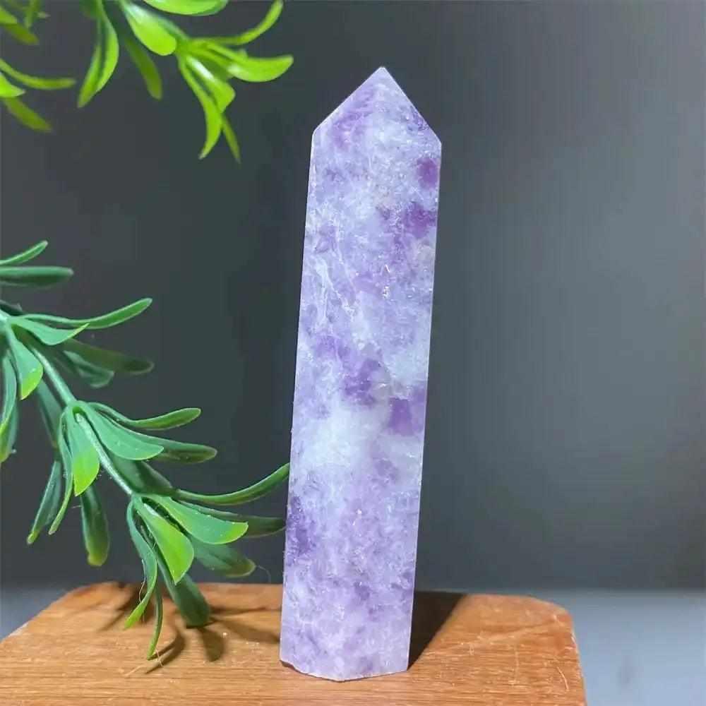 Polished lilac Lepidolite tower point with sparkling shimmer, perfect for calming energy and chakra balancing.