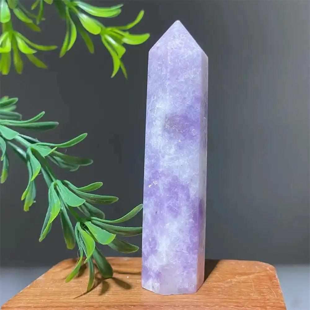 Polished Lepidolite tower point with soft lilac tones and a sparkling shimmer, perfect for calming energy and meditation.