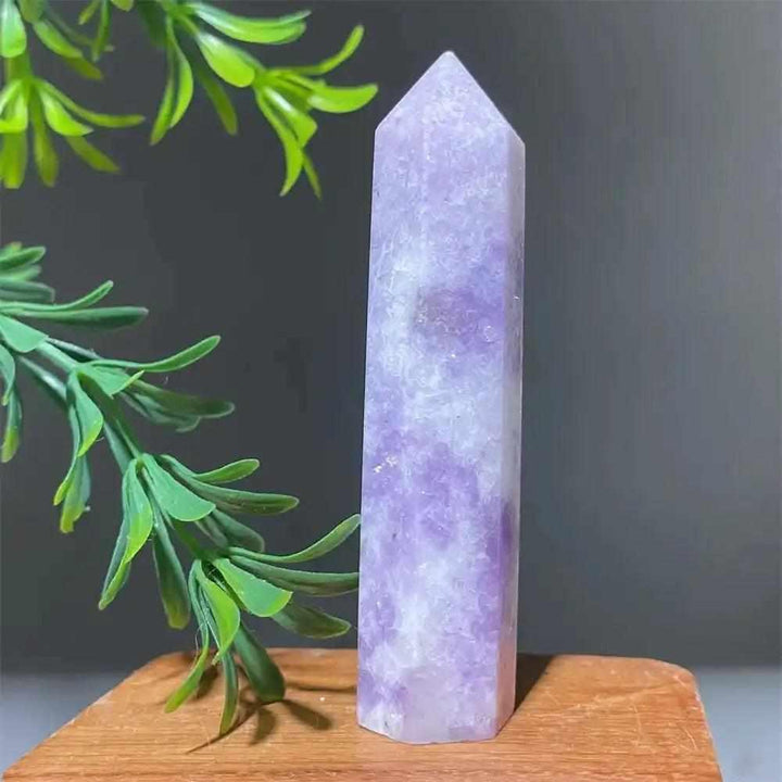 Polished Lepidolite tower point with soft lilac tones and a sparkling shimmer, perfect for calming energy and meditation.