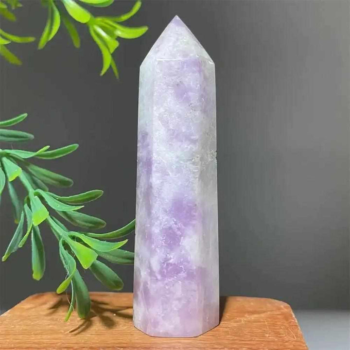 Polished lilac Lepidolite tower point with a sparkling finish, perfect for Heart and Crown Chakra healing and meditation.
