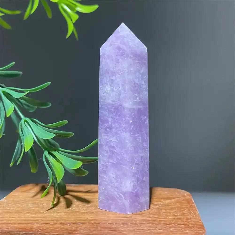 Polished lilac Lepidolite tower point with a sparkling finish, perfect for calming energy and chakra alignment.