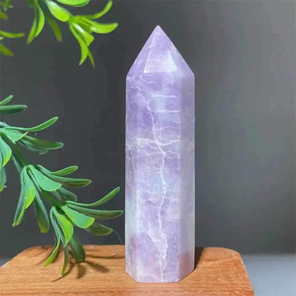 Polished lilac Lepidolite tower point with a sparkling finish, perfect for calming energy and chakra alignment.