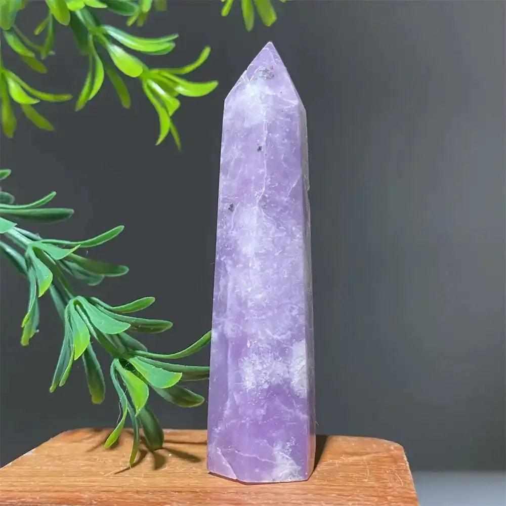 Polished lilac lepidolite tower point with sparkling shimmer, perfect for calming energy and chakra alignment.