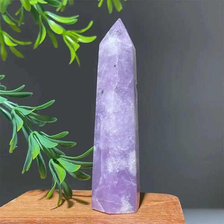 Polished lilac lepidolite tower point with sparkling shimmer, perfect for calming energy and chakra alignment.