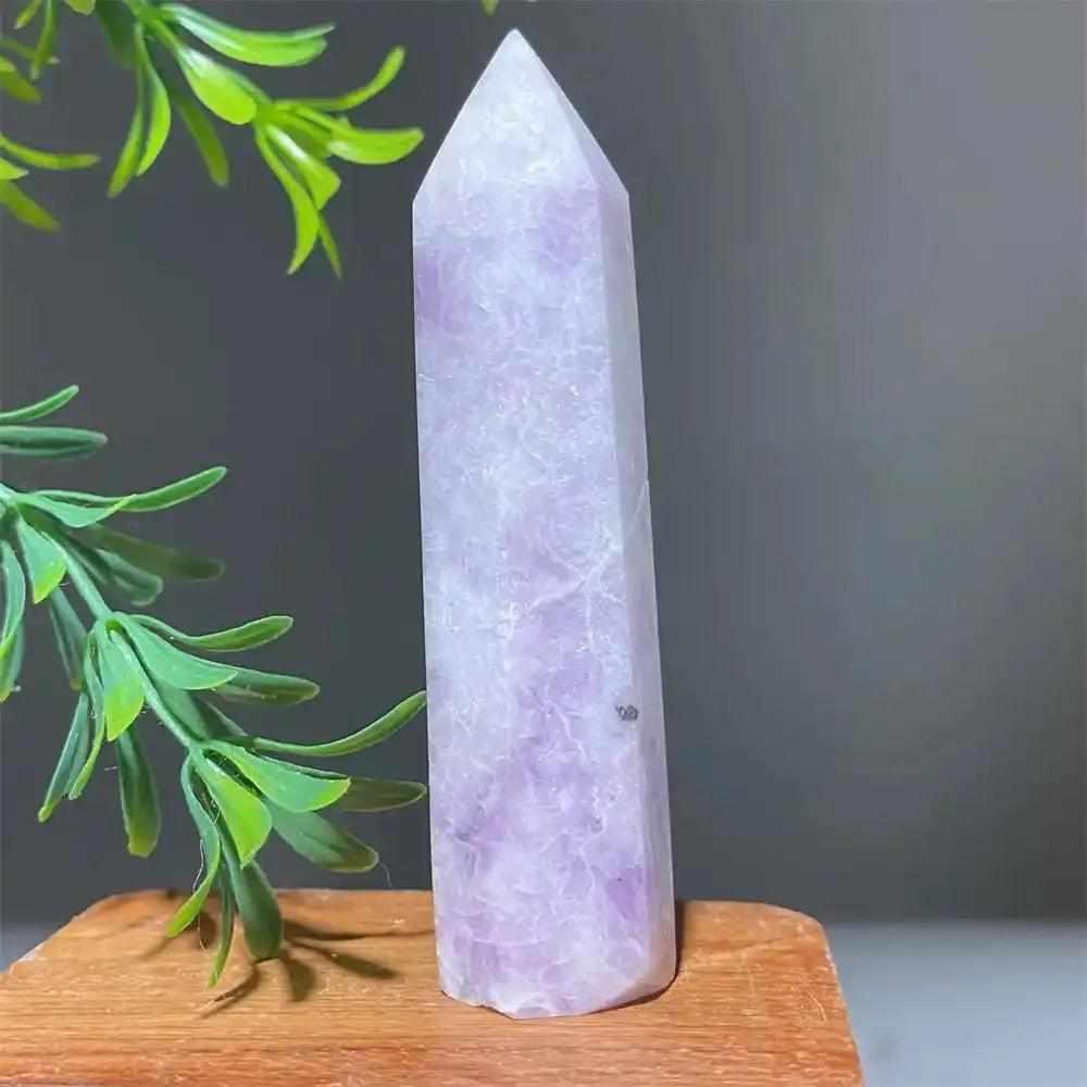 Polished lilac Lepidolite tower point with a sparkling finish, perfect for calming energy and crystal healing displays.