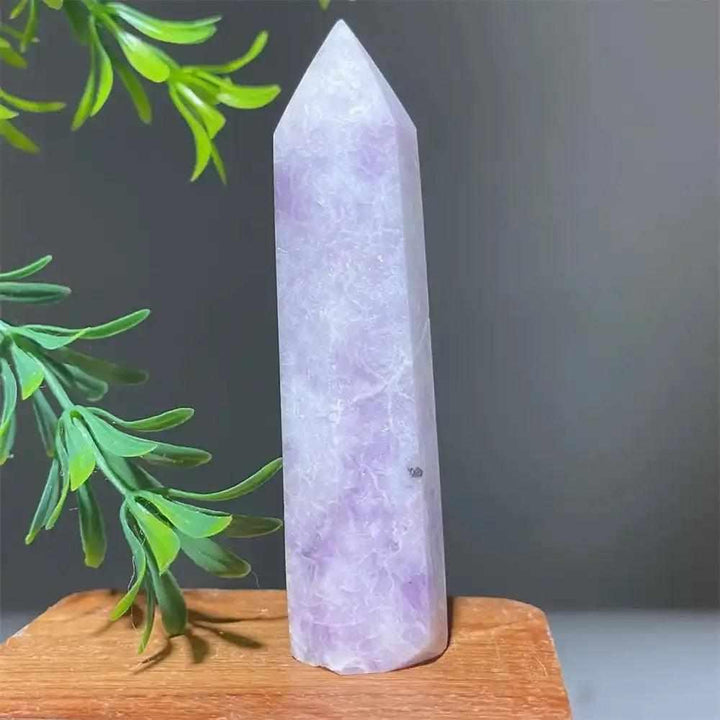 Polished lilac Lepidolite tower point with a sparkling finish, perfect for calming energy and crystal healing displays.