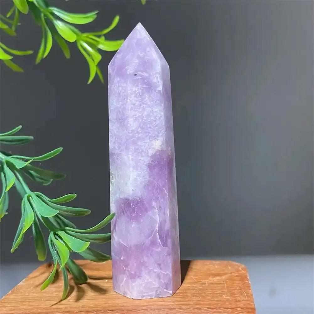 Polished lilac Lepidolite tower point with sparkling shimmer, perfect for calming energy and chakra alignment.