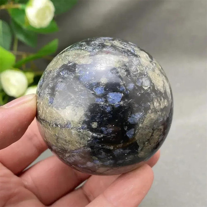 Rare Llanite Crystal Sphere with captivating blue, pink, and gray tones, promoting empowerment and balance.