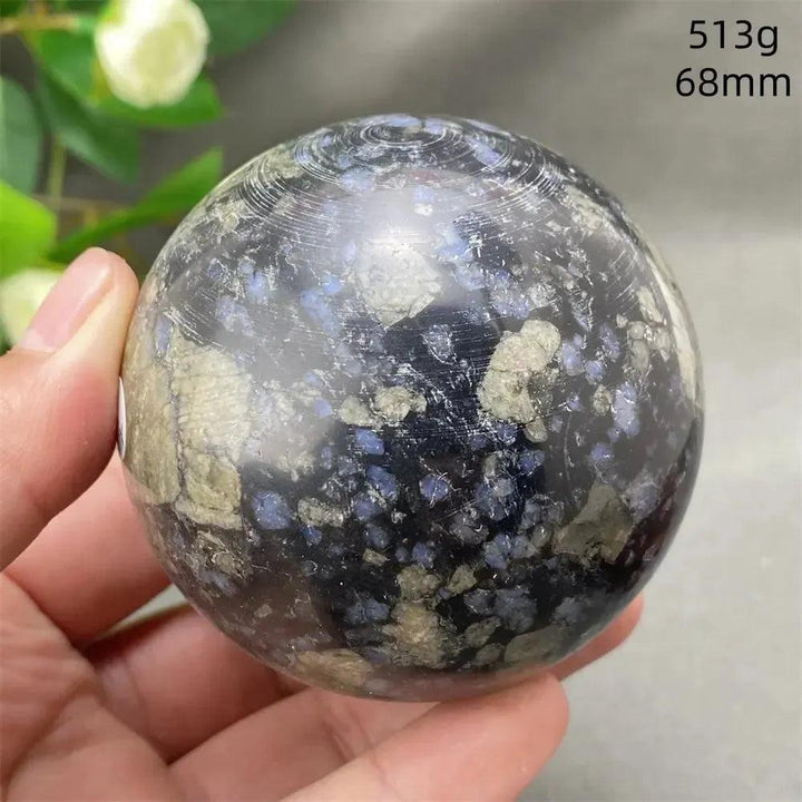 Llanite Crystal Sphere: Rare, polished blue, pink, and gray stone for empowerment and balance.