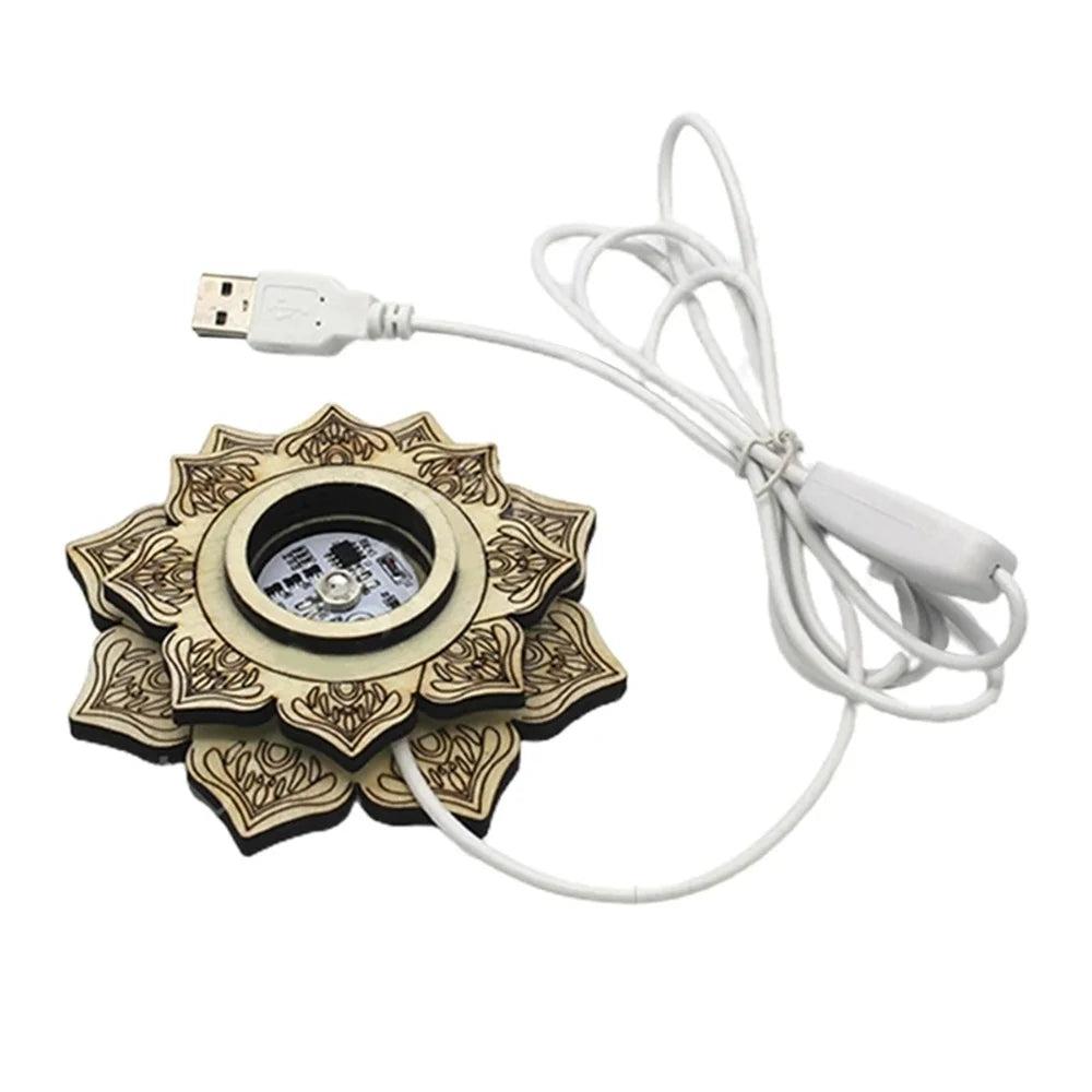 Carved natural wood lotus LED stand with intricate details, a central light, and a white USB power cord.