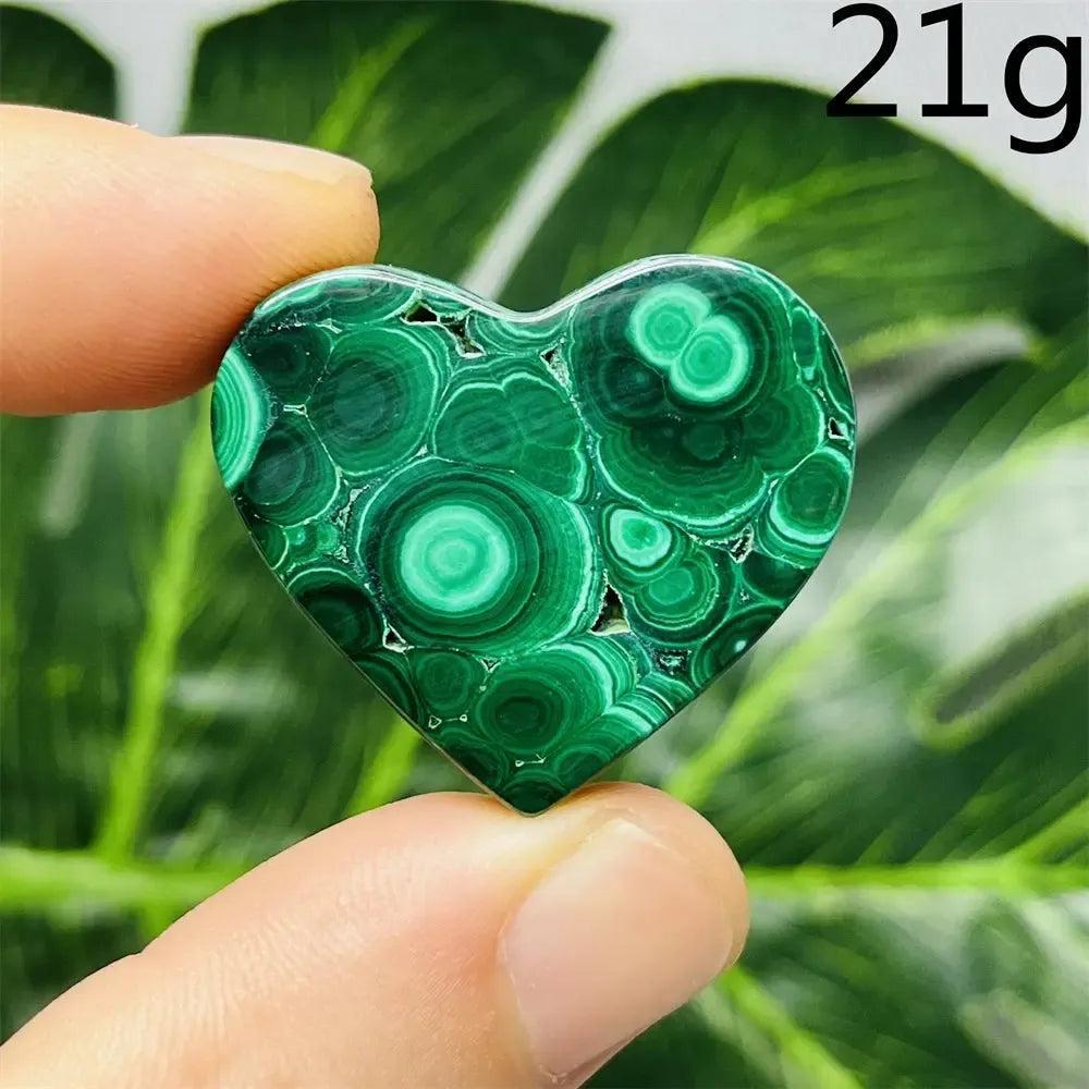 Malachite Crystal Heart, 21g, with deep forest green bands, promoting emotional healing and spiritual growth.