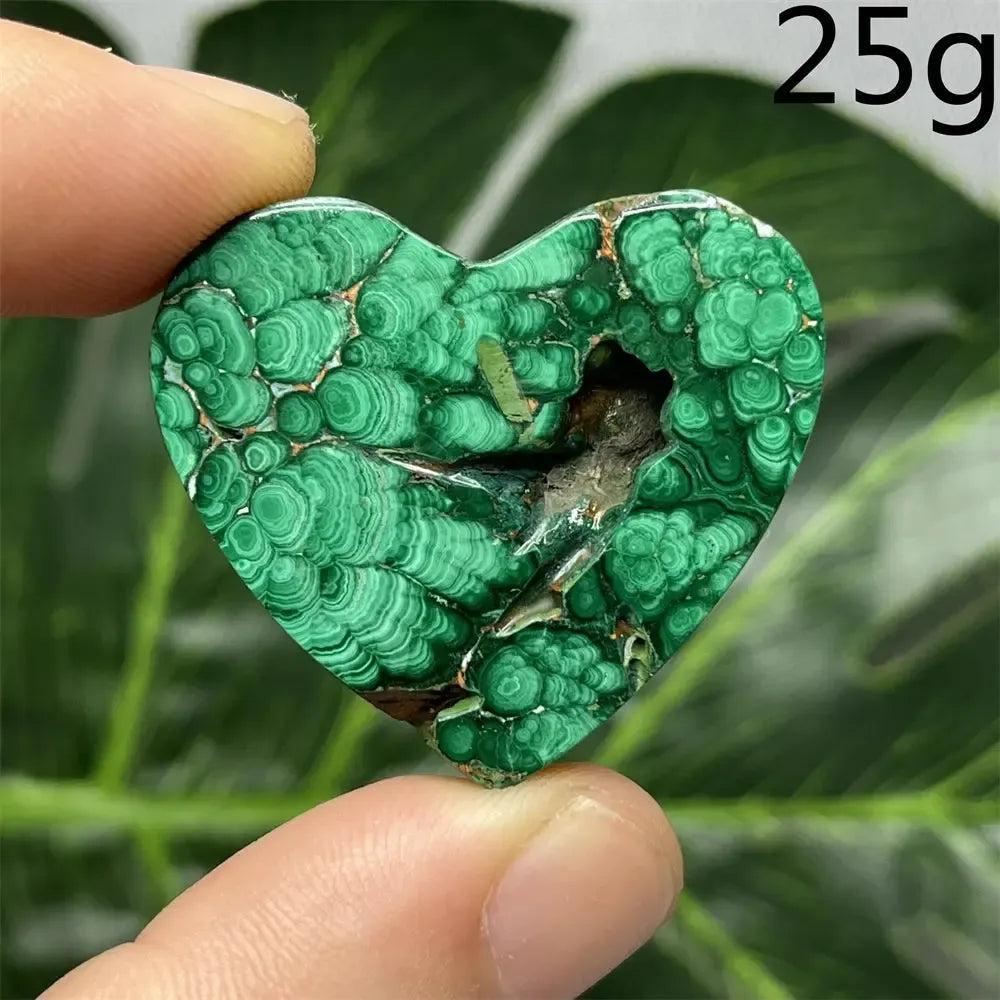 Malachite Crystal Heart: Polished deep forest green heart-shaped stone with mesmerizing bands and natural raw inclusions.