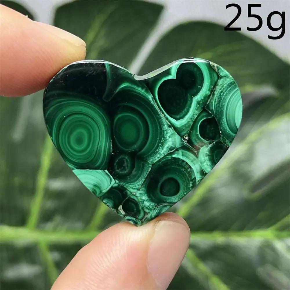 Malachite Crystal Heart: Polished deep forest green heart-shaped stone with mesmerizing banded patterns, weighing 25g.