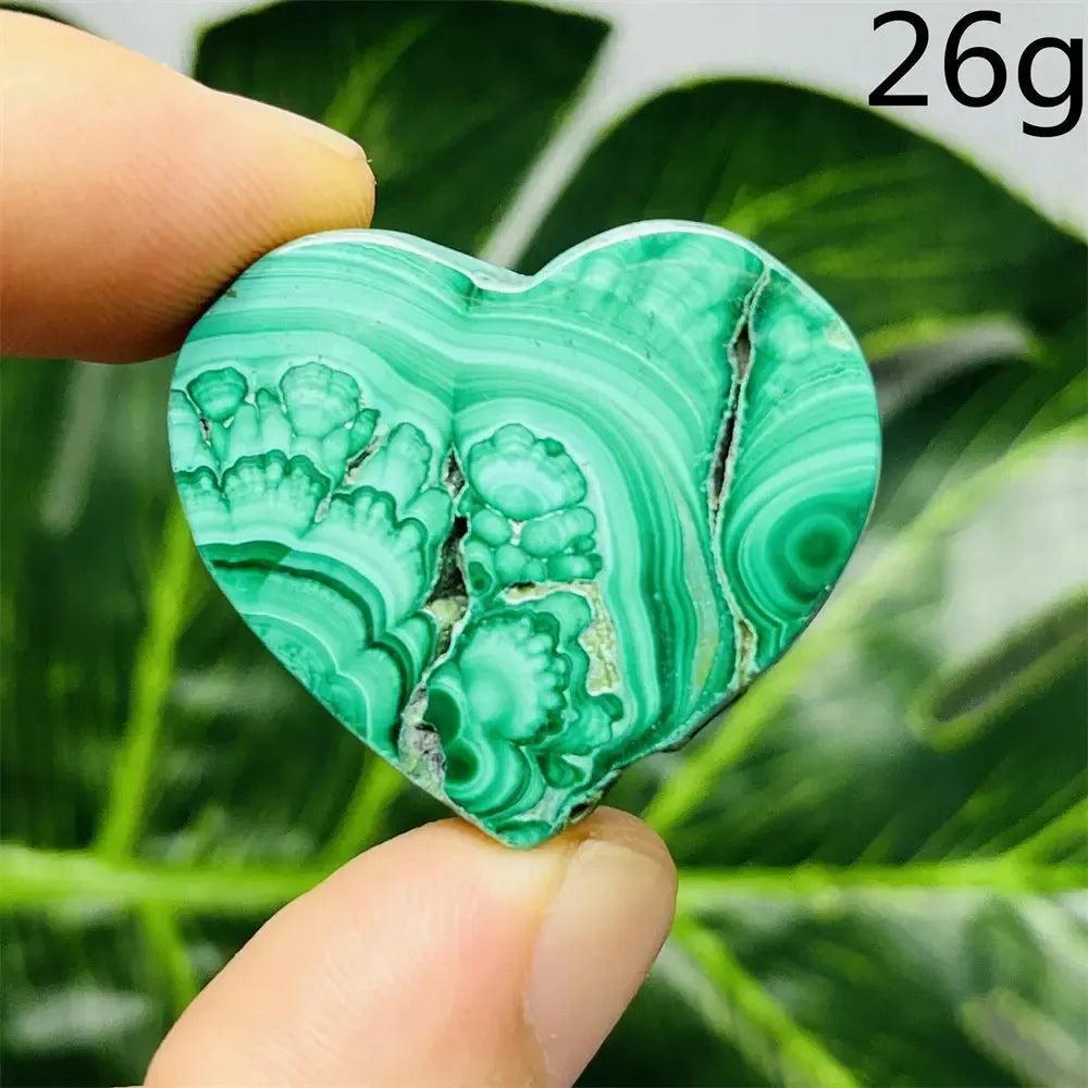 Malachite Crystal Heart: Polished deep forest green heart with mesmerizing bands, radiating powerful protective energy.
