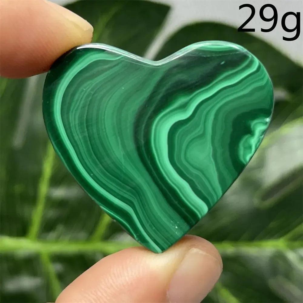 Malachite Crystal Heart: Polished deep forest green heart with mesmerizing banded patterns, radiating protective energy.