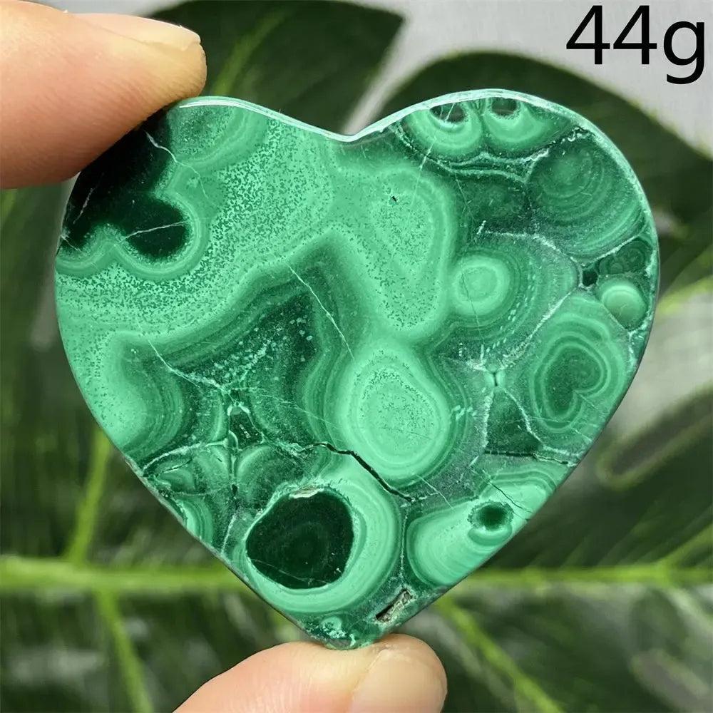 Malachite Crystal Heart: Polished deep forest green heart with mesmerizing banded patterns, radiating protective energy.