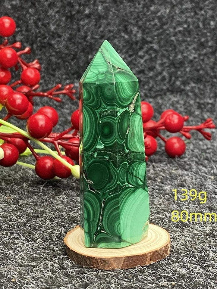 Polished Malachite crystal hexagonal obelisk tower with vibrant green banded patterns for healing and transformation.