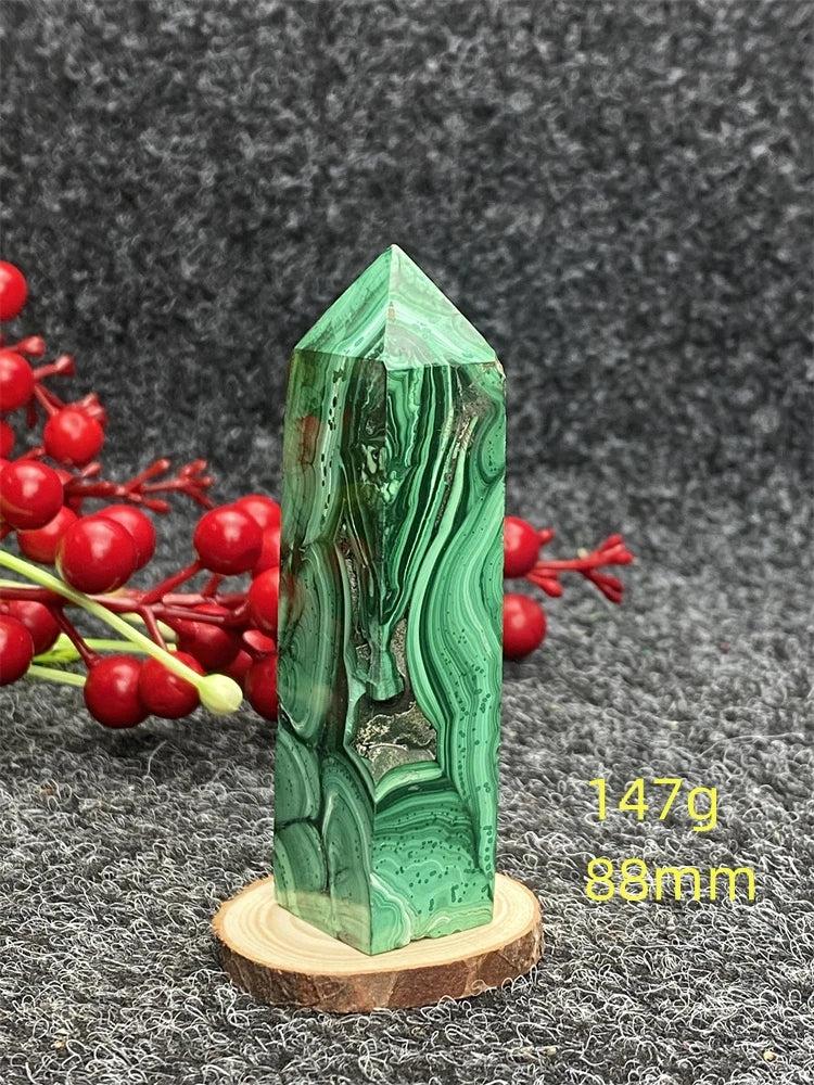 Polished Malachite hexagonal obelisk tower with vibrant green banded patterns for healing and transformation.