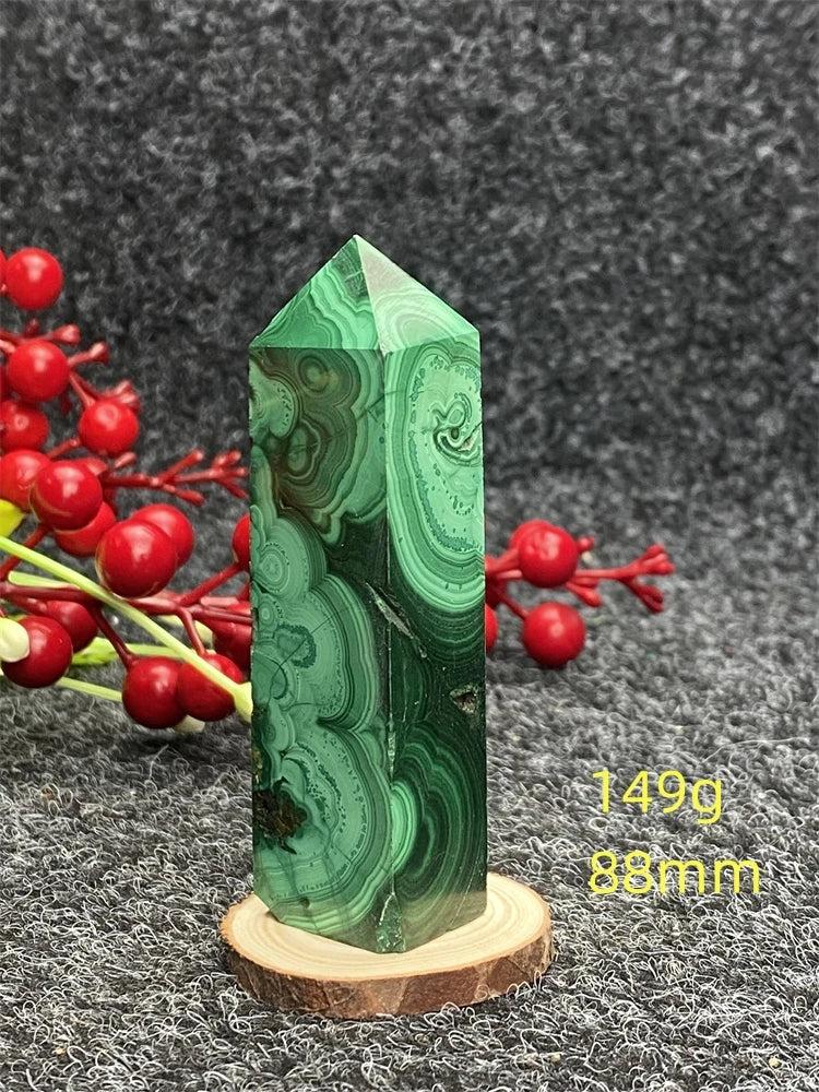 Polished Malachite hexagonal obelisk tower with vibrant green banded patterns for healing and transformation.