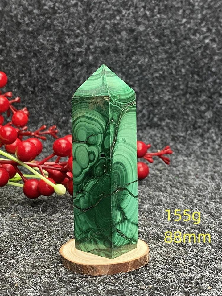 Polished Malachite hexagonal obelisk tower with unique green banded patterns for healing and transformation.