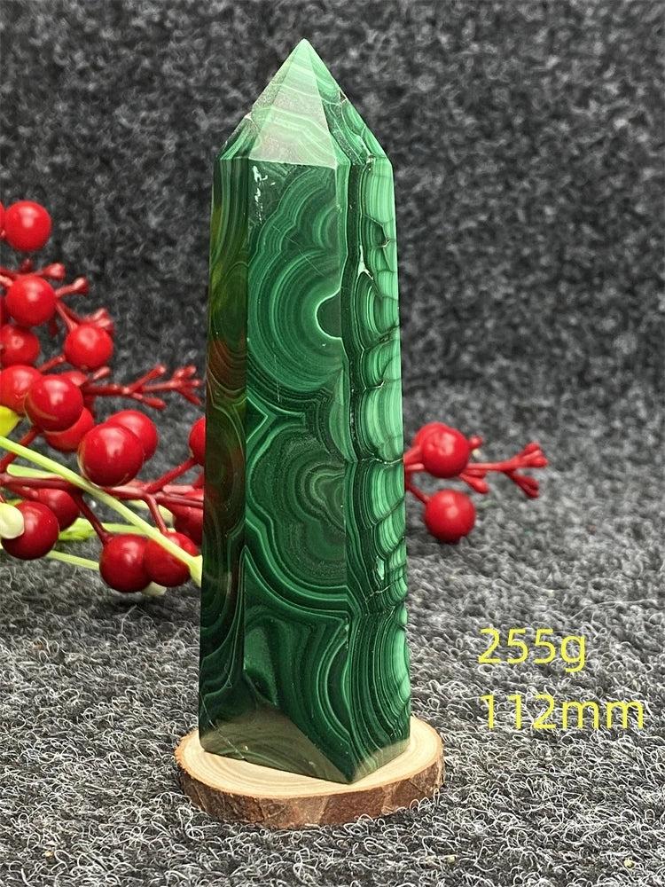 Polished Malachite hexagonal obelisk tower with vibrant green banded patterns for healing and transformation.