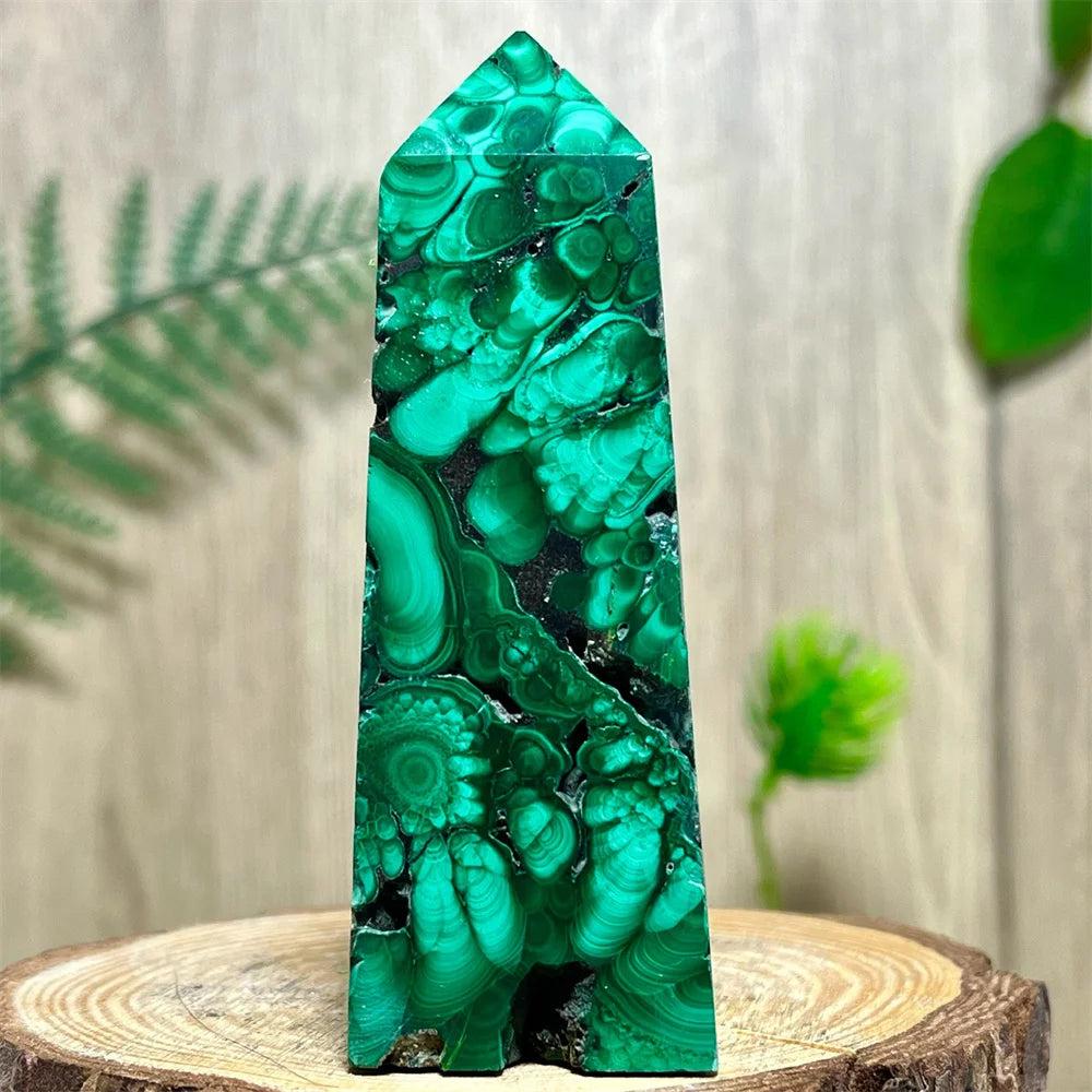 Polished Malachite crystal obelisk tower featuring vibrant, swirling green banded patterns for deep heart healing.
