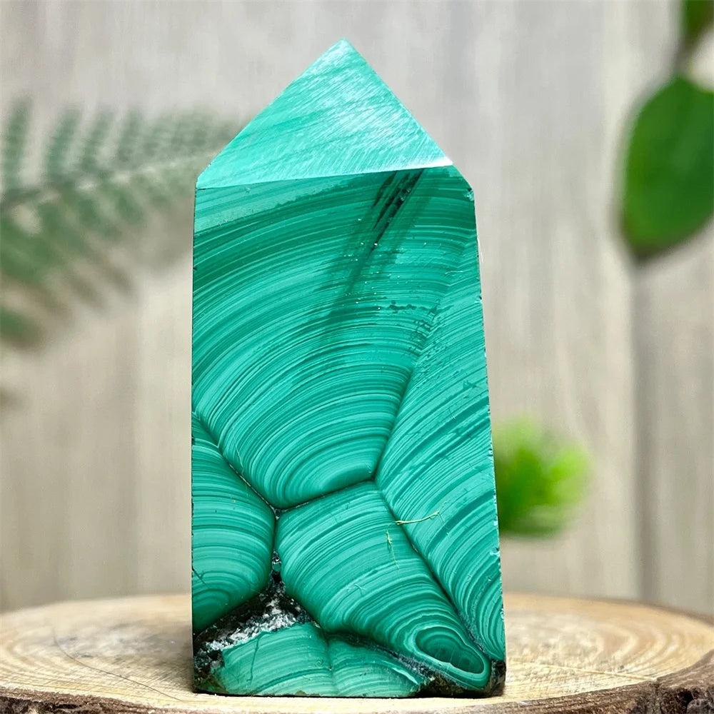 Polished Malachite Crystal Obelisk Tower featuring vibrant, deep green banded patterns for heart chakra healing.