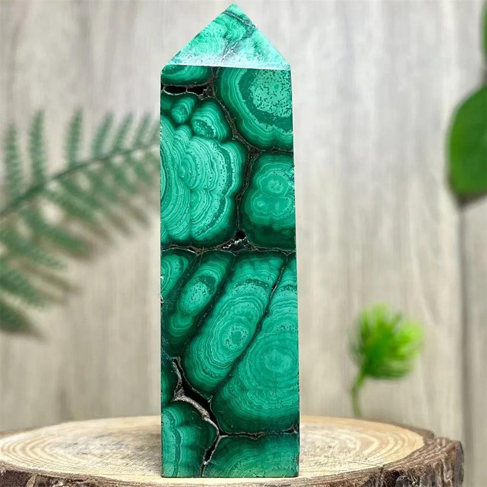 Polished Malachite crystal obelisk tower featuring vibrant, swirling green bands for heart chakra healing and energy.